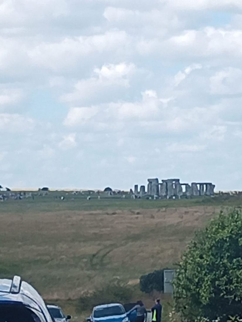 Cars and motorhomes dot the countryside for miles around